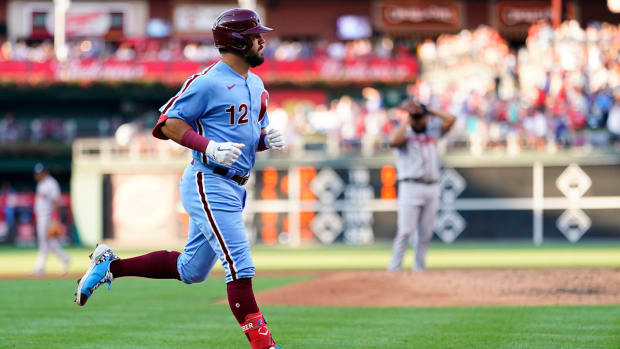 Philadelphia Phillies’ Kyle Schwarber, left, rounds the bases after hitting a three-run home run against Atlanta Braves pitcher Jesus Cruz during the fourth inning of a baseball game, Thursday, June 30, 2022, in Philadelphia.